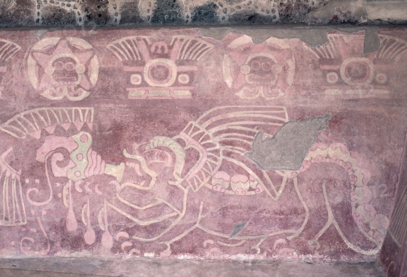 Detail of a polychrome Jaguar mural showing the animal blowing a conch shell