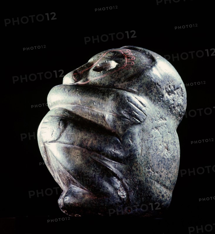 Figure in the form of a seated man