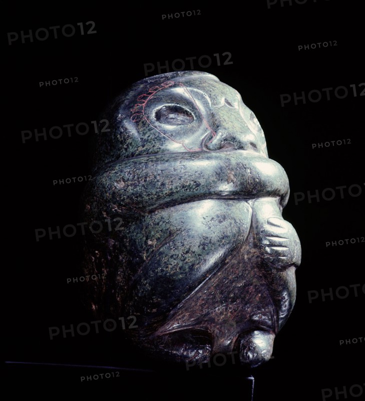 Figure in the form of a seated man