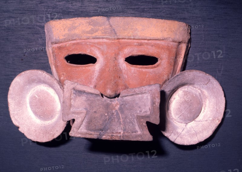 Mask showing the facial adornment worn by the nobility   a nose pendant and ear spools