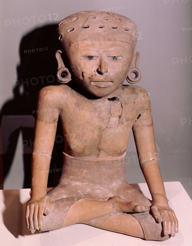 Seated figure of a woman wearing a wrap over skirt and ear spools