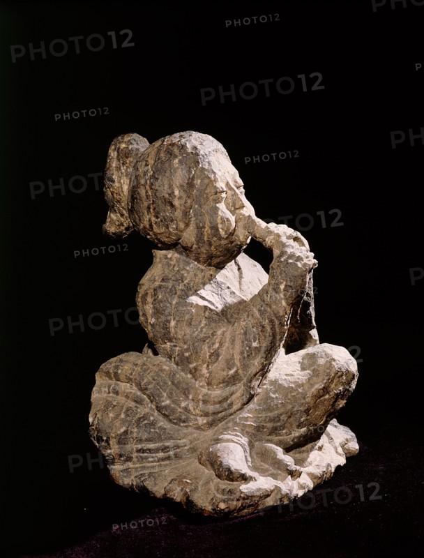 Tomb figure of a seated female musician