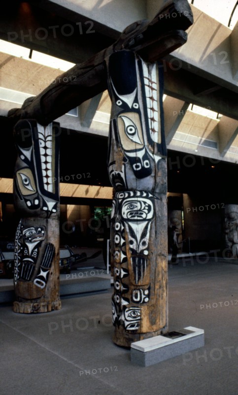 Two front house posts in the form of sea lions support the main beam of the house in the form of Sisiutl, the double headed serpent