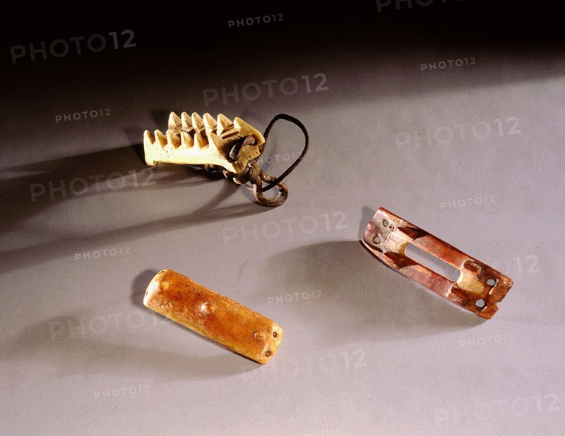 Bone crampons which were lashed to boots to improve traction