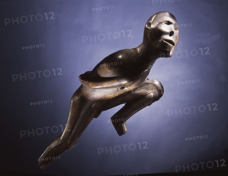Wooden figure of an emaciated man, probably a shaman