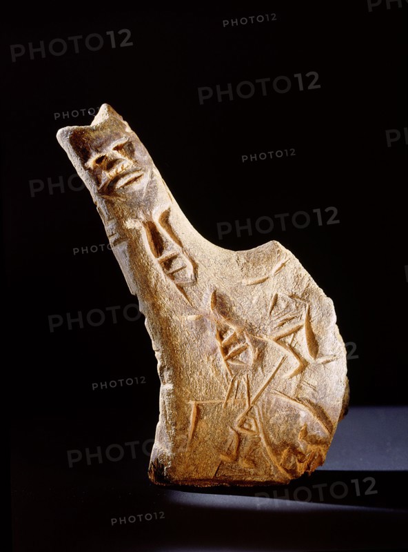 Antler wand incised with human faces