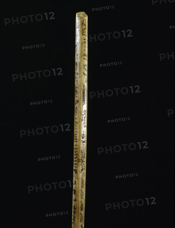 Broken ivory bow drill handle with incised sketches of hunting and travel scenes