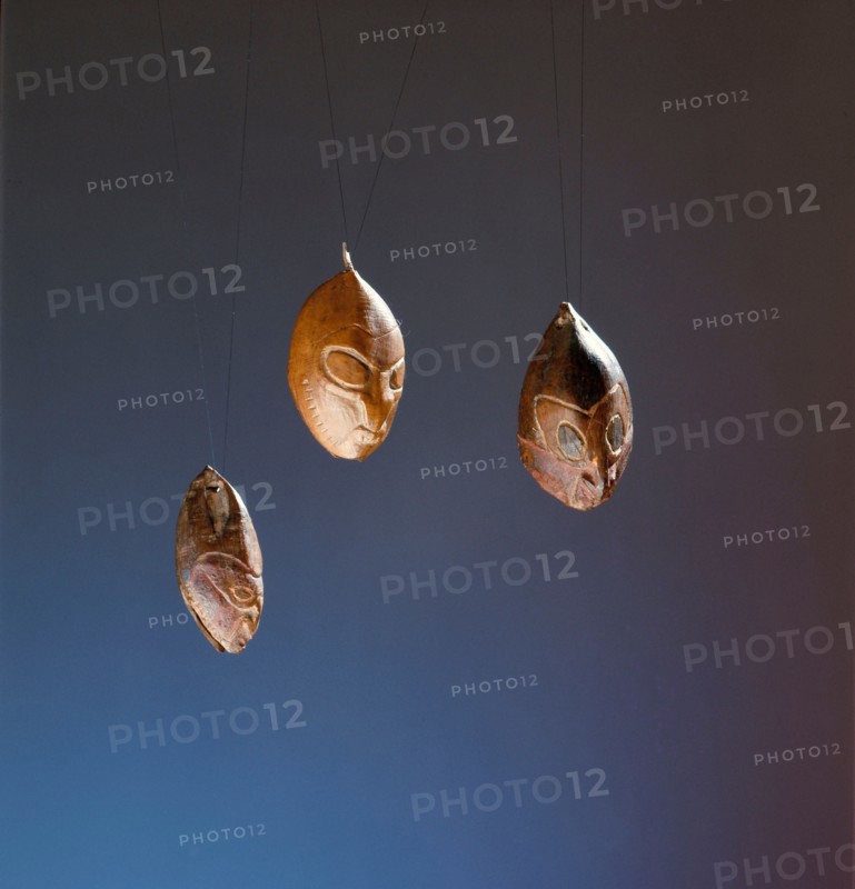 Nuts or seeds carved with ancestral faces