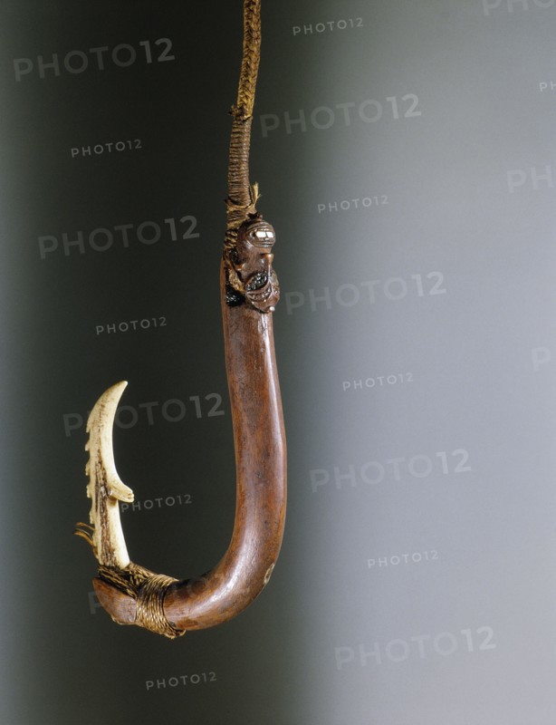 A barbed composite matau fish hook, the shank made by training a growing branch into shape