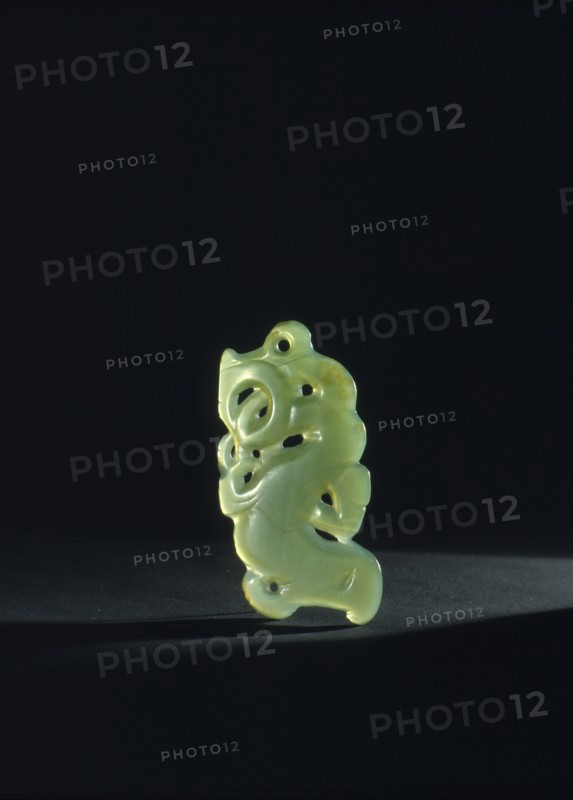 A small jade ornament depicting a taniwha or sea monster