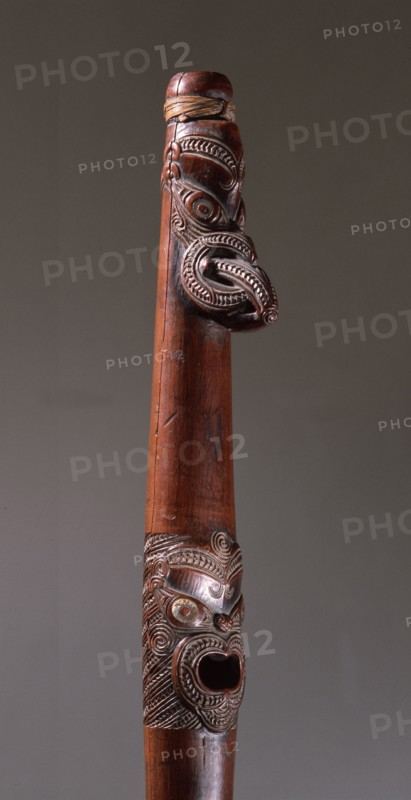Putorino, or flute trumpet carved with three aggressive faces