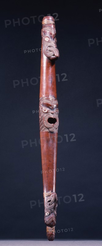 Putorino, or flute trumpet carved with three aggressive faces