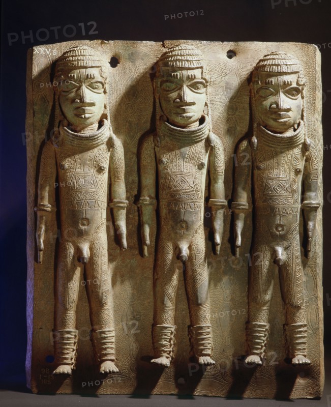 A brass plaque from the palace of the Oba of Benin, depicting three of the naked royal pages known as Omada