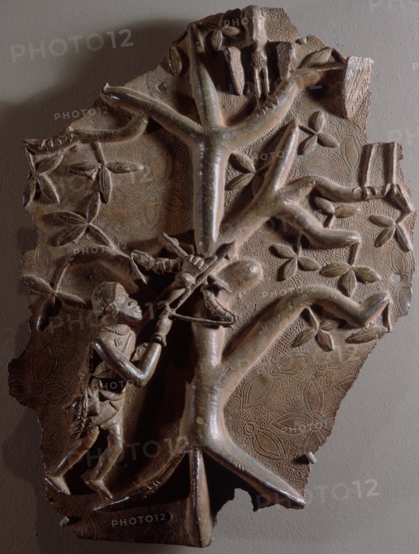 A plaque depicting a hunter, possibly a Portuguese soldier, armed with a crossbow
