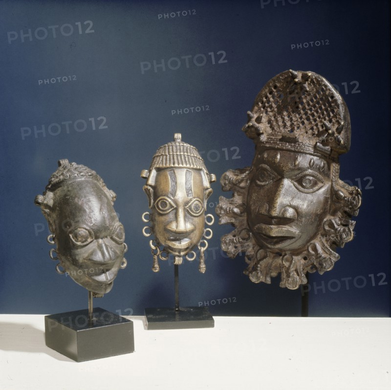Three ornamental hip masks which formed part of the regalia of Benin chiefs