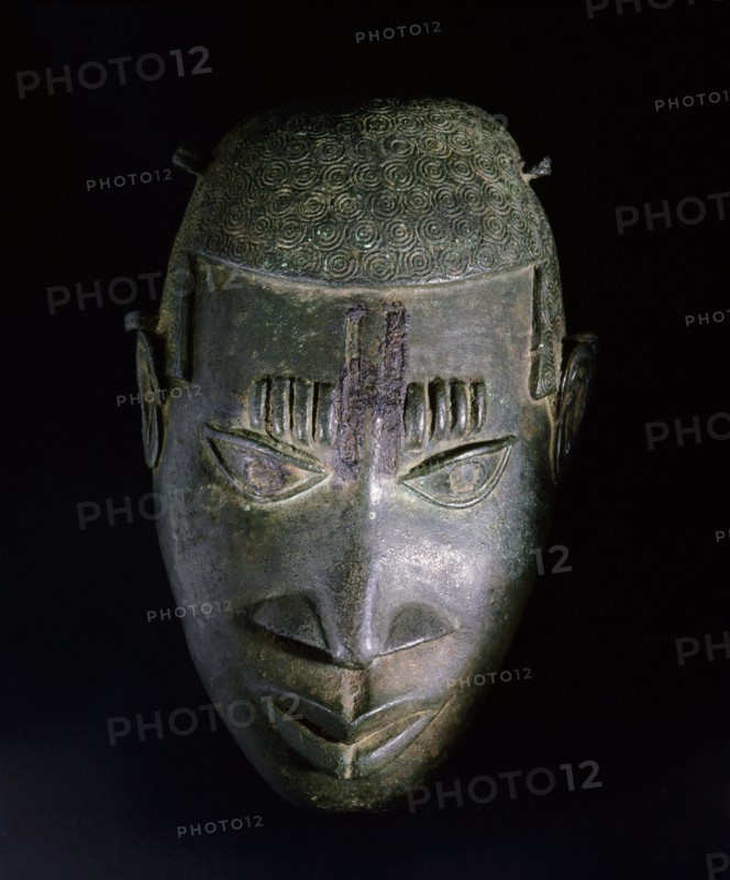 An ornamental hip mask which formed part of the regalia of important Benin chiefs