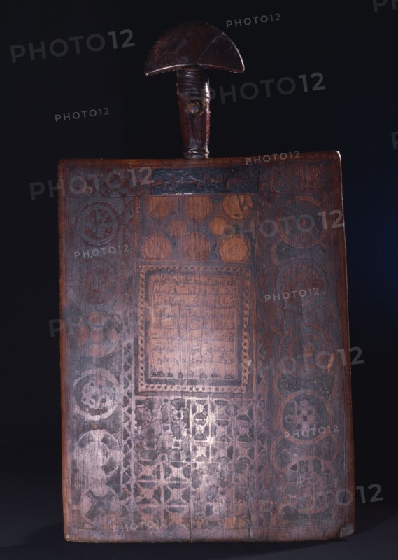 Unusually fine example of a Koran board, ornamented with abstract Islamic motifs and a text from the Koran