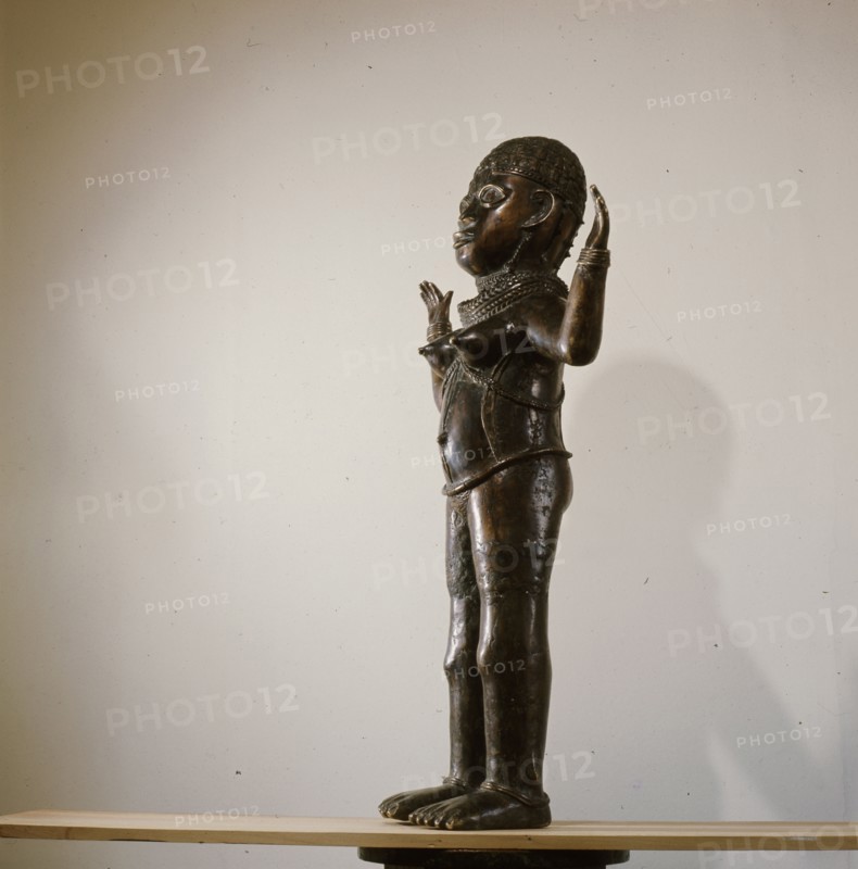 Along with two similar figures in museum collections this sculpture is a puzzling hybrid