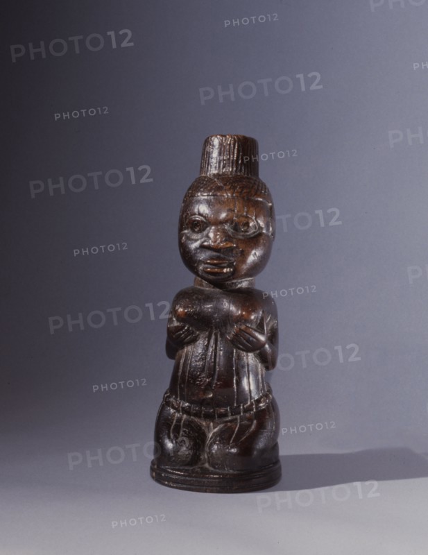 Ivory carving of a woman kneeling naked in a posture associated with supplication and oathtaking