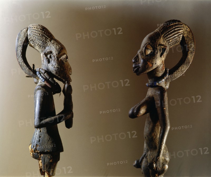 Shrine figures with the elongated hairstyle typical of the Yoruba orisha Eshu, the messenger and carrier of sacrifices to the other gods