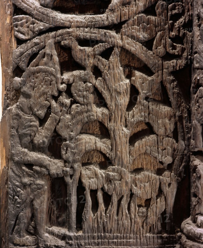Stave church carving with a scene from the story of Sigurd