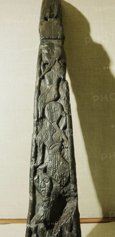 Human figures carved on the stem of the Oseberg ship