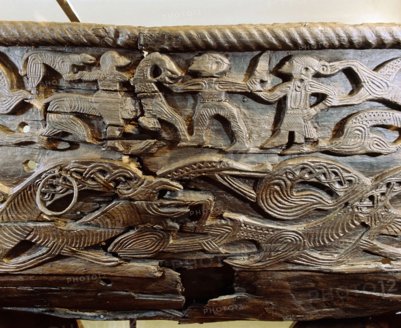 A detail of the decorative carving on the side of the Oseberg cart