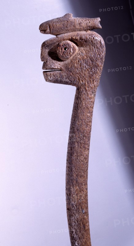 Club in the form of a stylised human with a fish