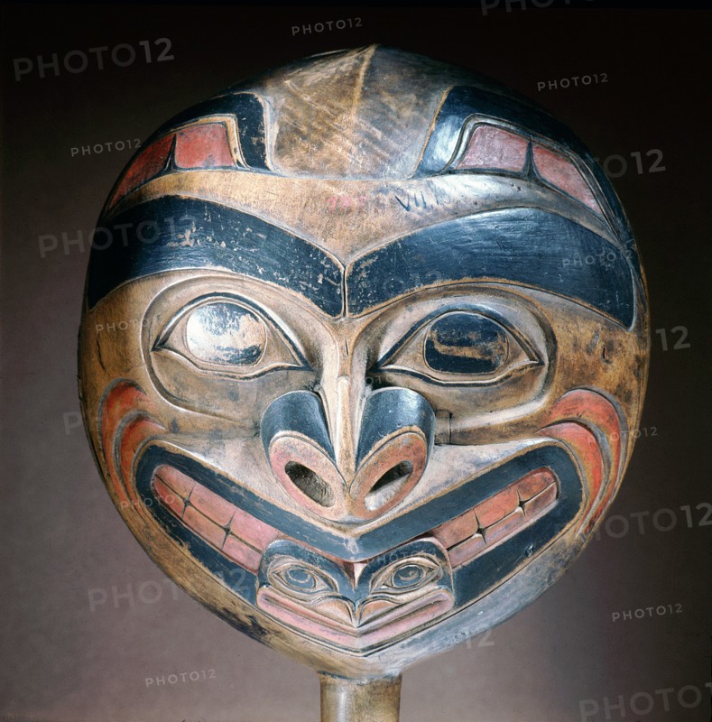 A shamans rattle carved with the design of a killer whale