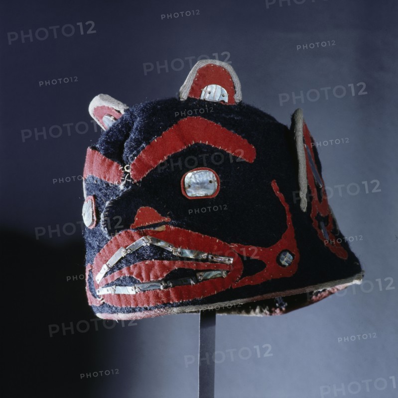 An unusual hat/headdress made from European felt with a bold appliqued design of a face