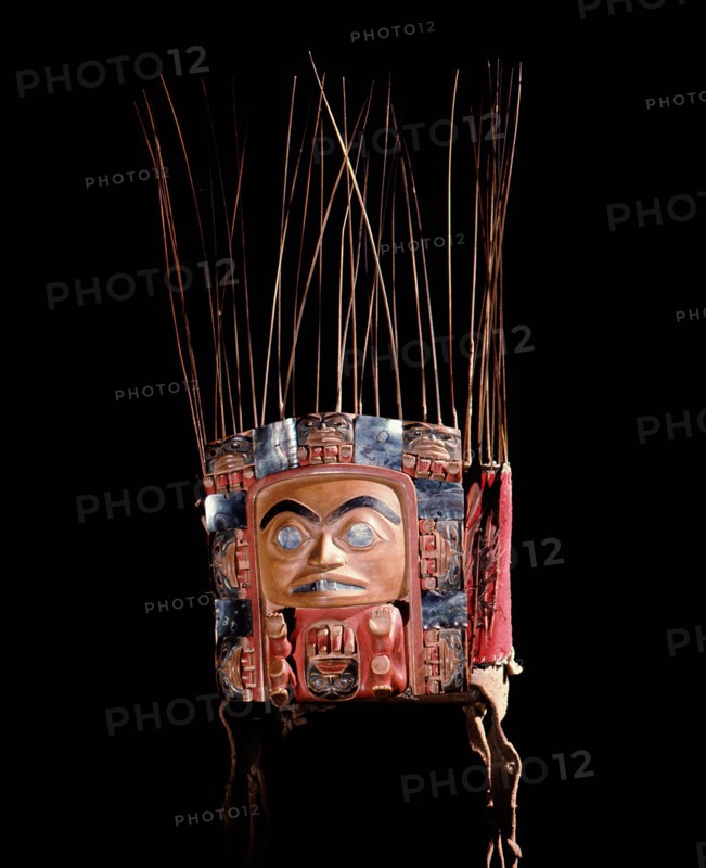 Frontlet with a human figure surrounded by seven smaller figures interspersed with abalone shell