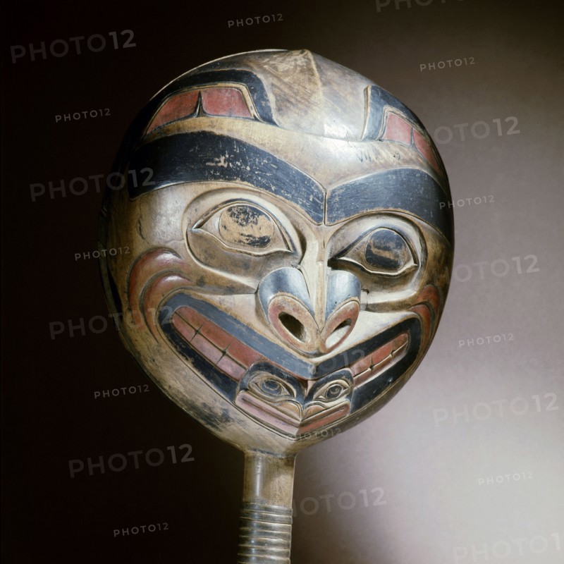 A shamans rattle carved with the design of a killer whale