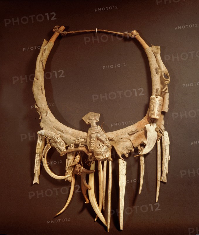 Part of a Haida shamans gear included a neckring from which various bone and ivory charms were suspended