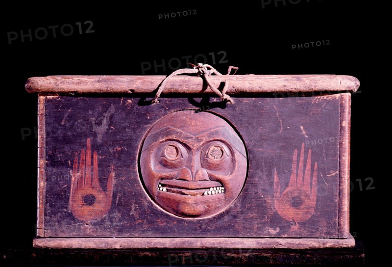 A shamans storage chest carved with a face representing the moon