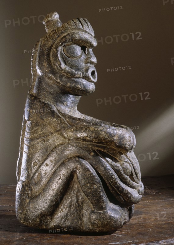 Stone human figure bowl, thought to have been used by Salish shamans in purification rites as part of ceremonies marking the onset of female puberty