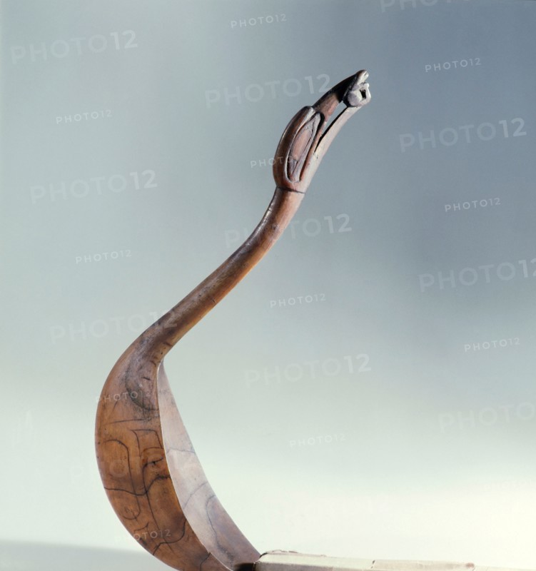 Spoon carved with a bird with a frog in its beak