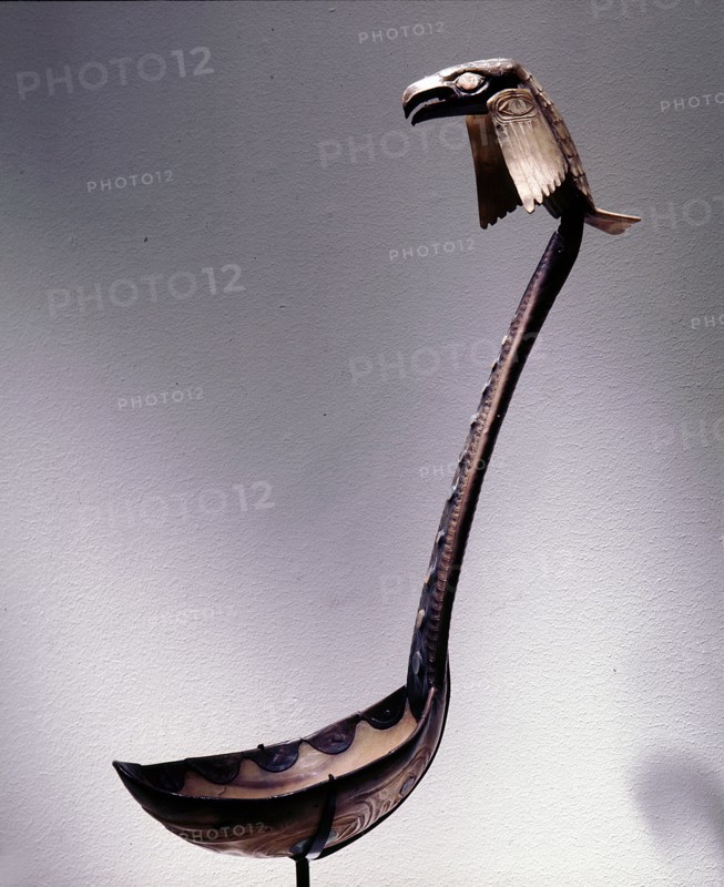 Ladle with a raven perched on the handle