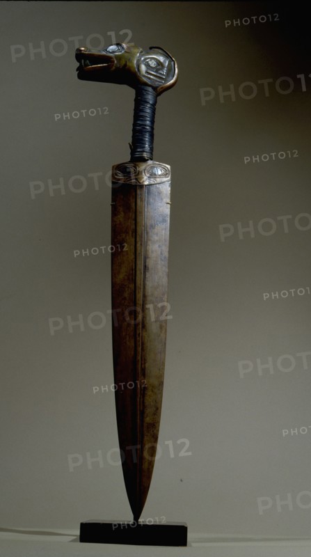 An iron bladed knife carved from the horn of a bighorn sheep and inlaid with iridescent abalone shell