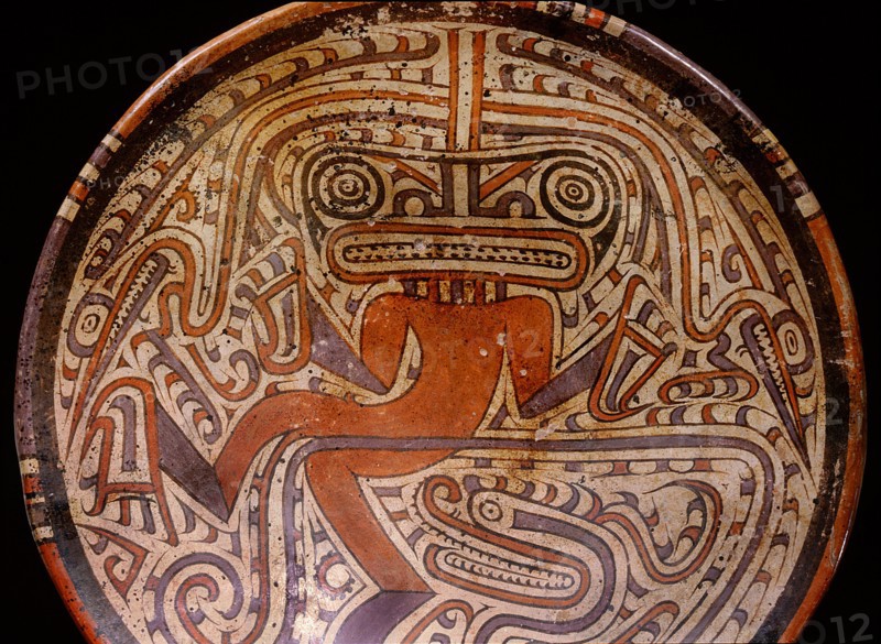 Elegant and typically Cocle style of polychrome ceramic plate, depicting dancing jaguar, crocodile, or supernatural creature, or even a shaman wearing a mask