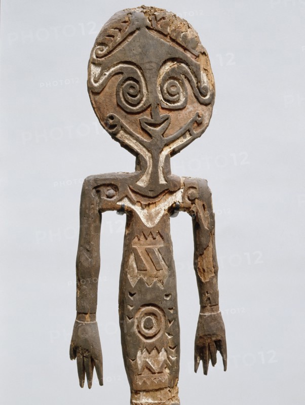 Painted two dimensional female figure incised on bark, from the Papuan Gulf area