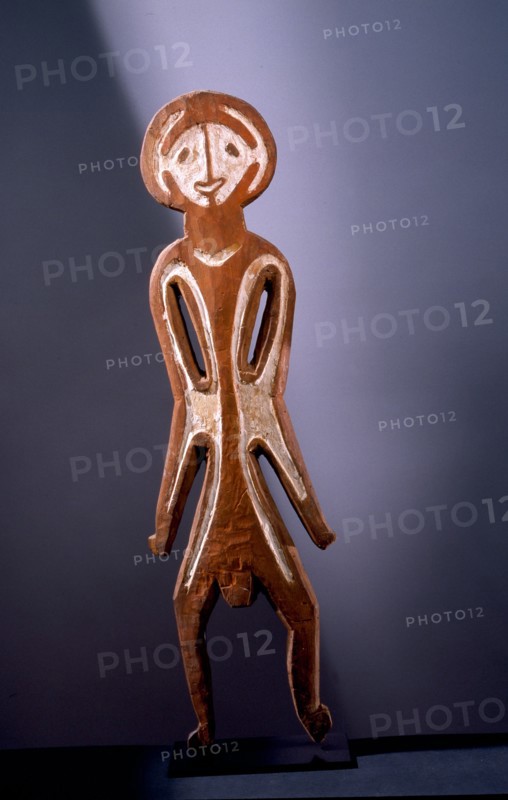 Painted two dimensional female figure incised on bark, from the Papuan Gulf area