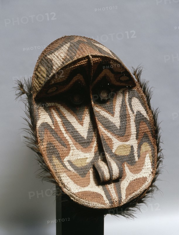 These large circular basketry masks represent female clan specific spirits and are hung inside the village mens meeting house to protect the clan members