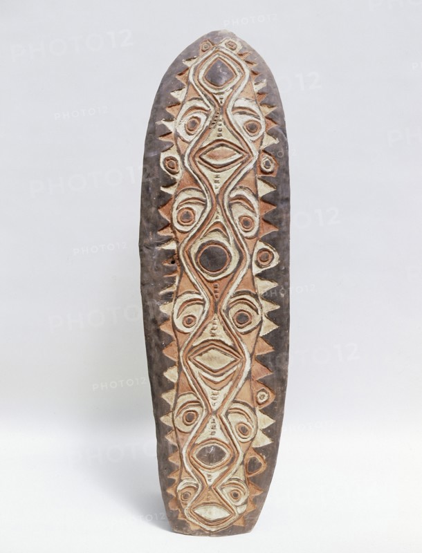 Shield with stylised low relief design