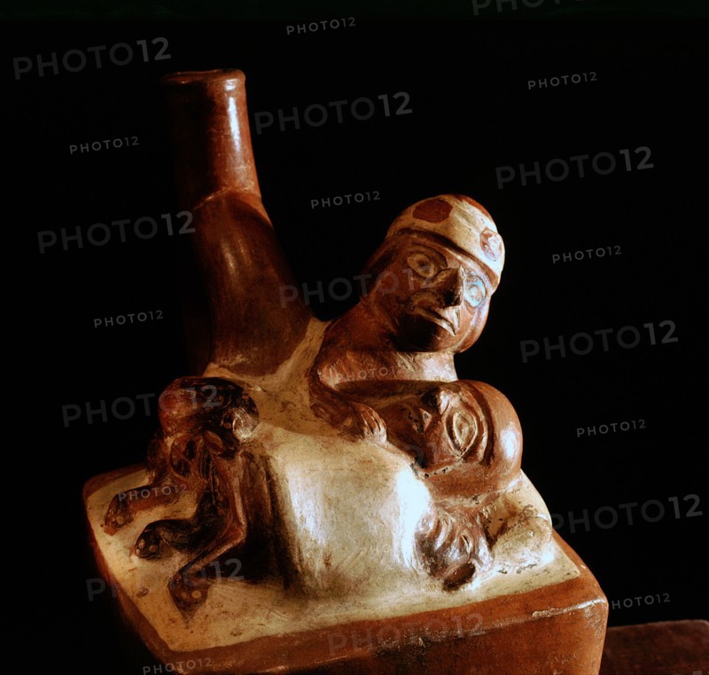Effigy jar depicting a man and woman, covered by a sheet, having sexual intercourse in a bed