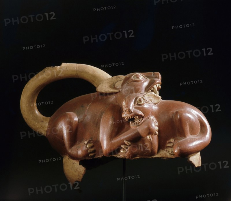 Fragment of a Mochica stirrup spouted jar showing two creatures fighting