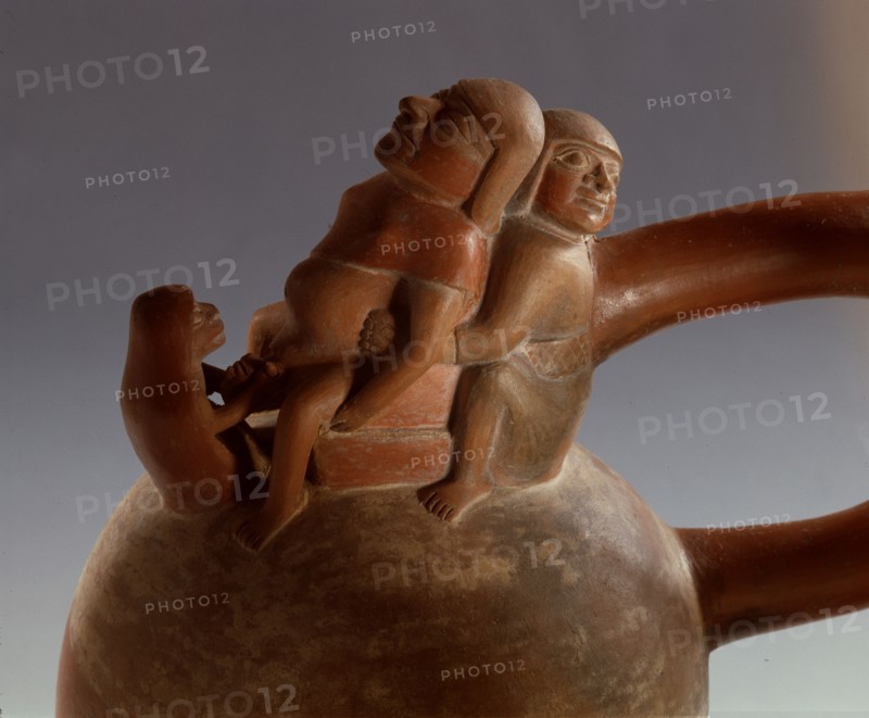 Mochica stirrup spouted jar showing birth scene