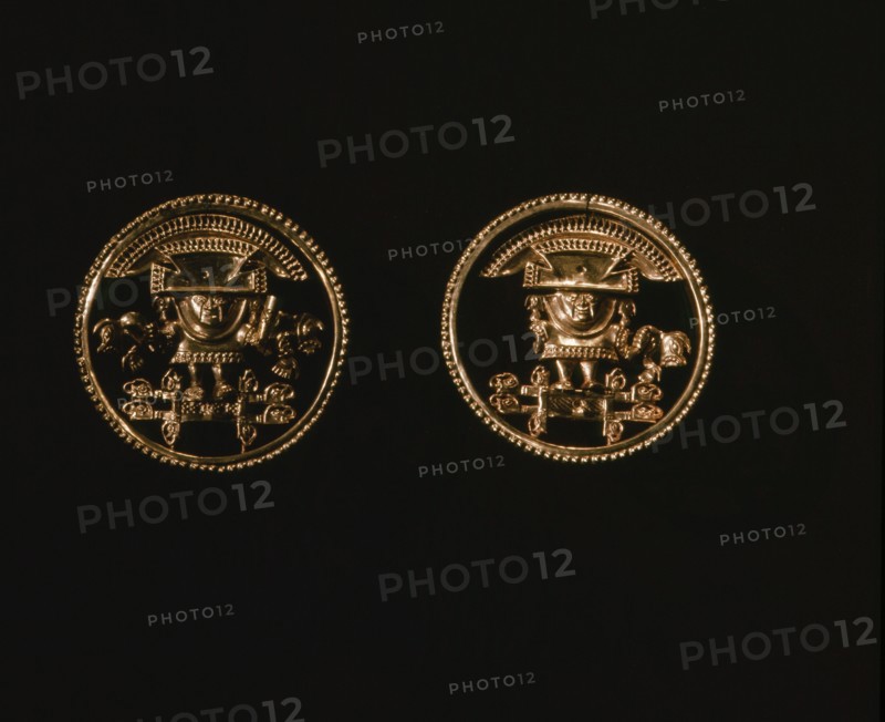 Elaborately cast gold discs, possibly earrings