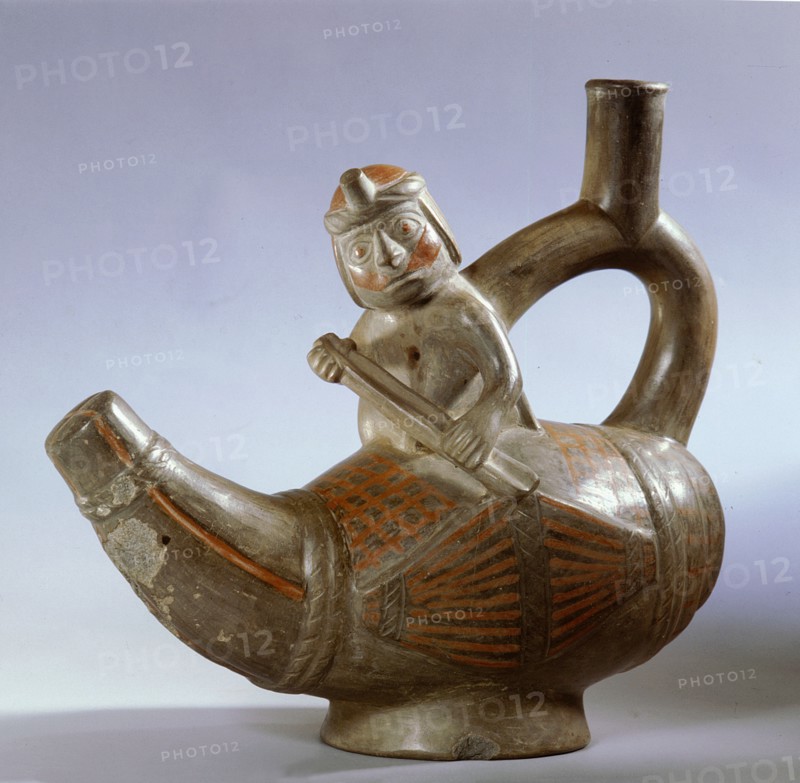 Stirrup spouted effigy showing a Mochica fisherman paddling a small totora reed boat