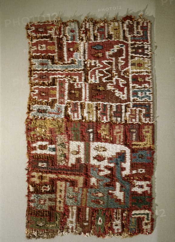 A small fragment of an early Peruvian embroidered textile, probably from the Paracas culture