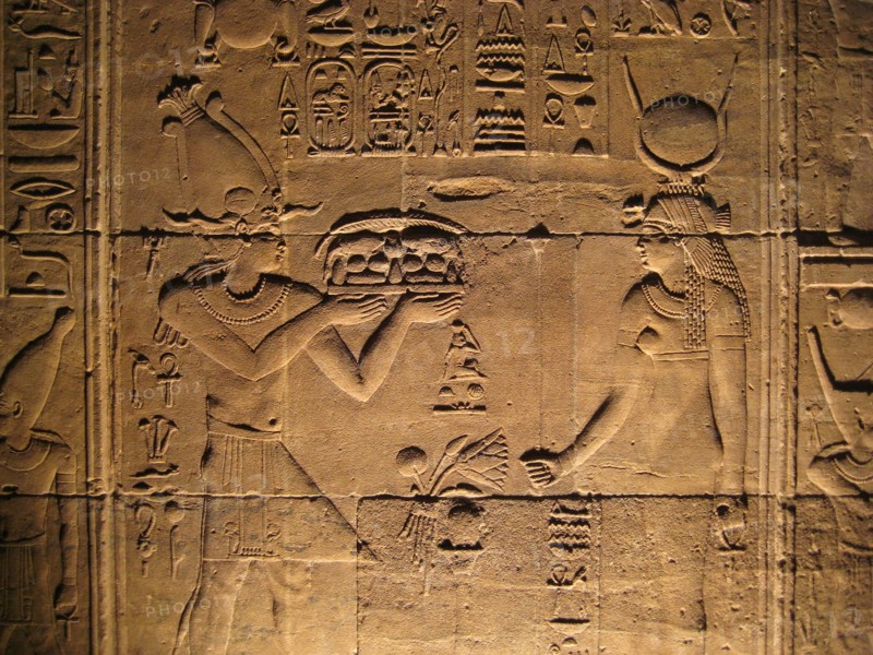 Relief from the inner sanctum of the temple of Isis depicting a pharaoh offiering gifts to the goddess